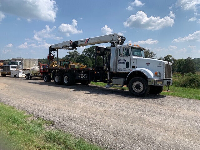 2003 6×6 Peterbilt equipped with a Fassi F390 and 92 ft reach 16” grapplesaw