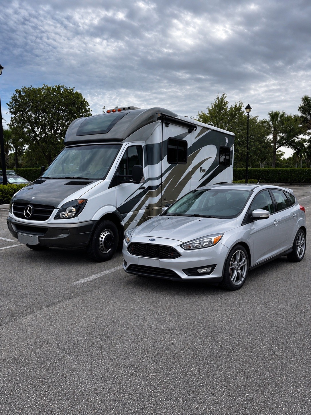 2014 Mercedes-Benz Sprinter Profile View with 2016 Ford Focus Hatchback